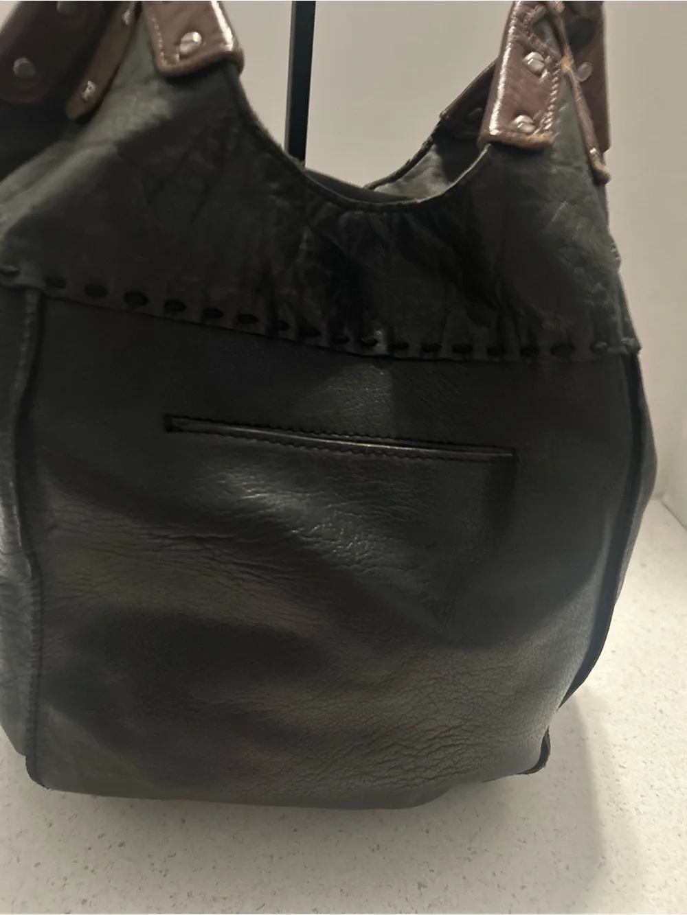 The Sak Black Leather Hobo Bag with Brown Trim